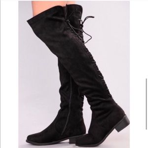 Black Thigh high boots.